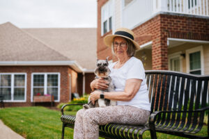 A female resident posing with her dog