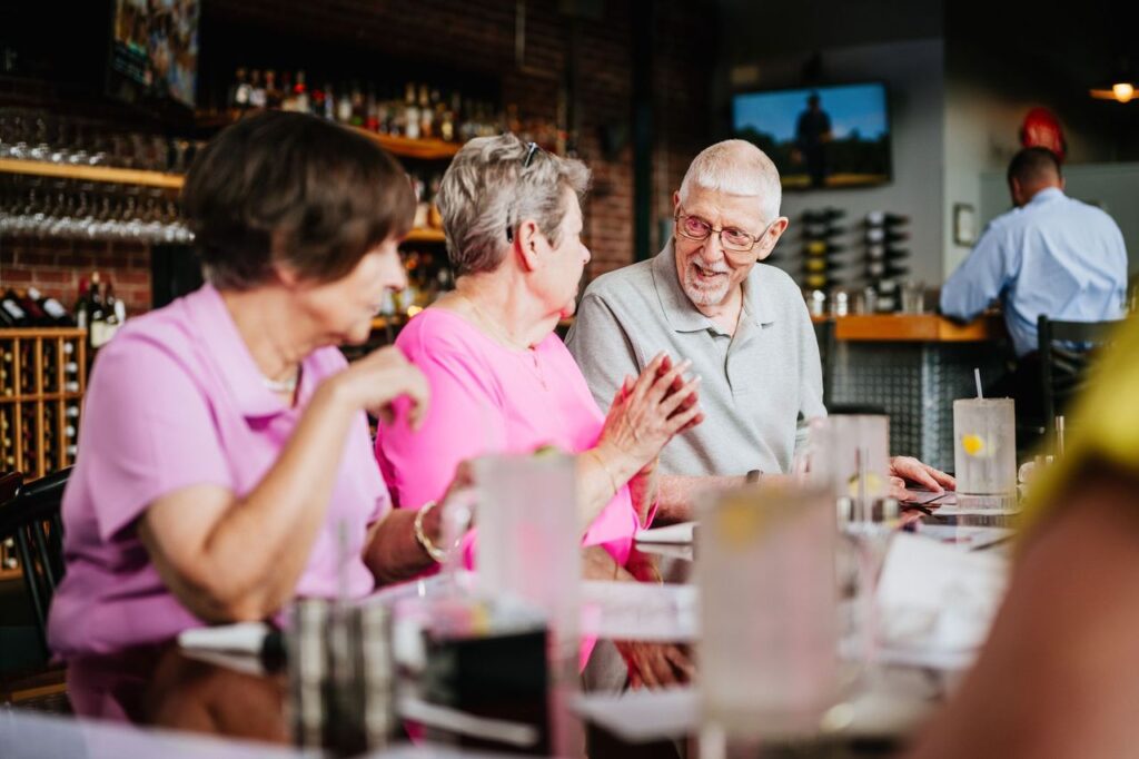 Seniors enjoying a night at a wine bar