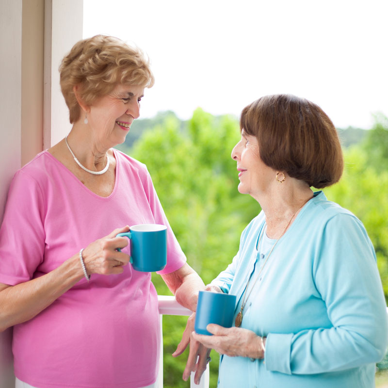 two women socializing at independent senior living community